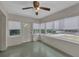 Sunny sun room featuring large windows with white blinds and natural light, a perfect relaxation space at 849 Driver Ave, Winter Park, FL 32789