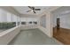Bright sun room with large windows offering plenty of natural light and pleasant outdoor views at 849 Driver Ave, Winter Park, FL 32789