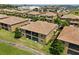 Aerial view of home, showcasing the screened patios and landscaped surroundings at 8990 Azalea Sands Ln # 8990, Davenport, FL 33896