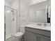 Clean bathroom featuring a glass shower, modern vanity, and bright lighting at 8990 Azalea Sands Ln # 8990, Davenport, FL 33896