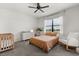 Comfortable bedroom with a modern dresser, plant accent, window view, and cozy crib at 8990 Azalea Sands Ln # 8990, Davenport, FL 33896