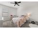 Cozy bedroom featuring a soft color palette, carpet, and a window for natural light at 8990 Azalea Sands Ln # 8990, Davenport, FL 33896