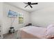 Bedroom featuring light walls, neutral carpet, and a large window for plenty of light at 8990 Azalea Sands Ln # 8990, Davenport, FL 33896