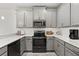 Well-equipped kitchen featuring modern appliances, stylish cabinetry, and bright countertops at 8990 Azalea Sands Ln # 8990, Davenport, FL 33896