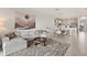 Inviting living area with a cozy couch and dining area leading to a modern kitchen at 8990 Azalea Sands Ln # 8990, Davenport, FL 33896