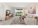 Inviting living room with a comfortable couch and a view of the community at 8990 Azalea Sands Ln # 8990, Davenport, FL 33896