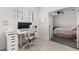 Bright office space featuring modern desk, chair, and ample natural light, with an adjacent bedroom at 8990 Azalea Sands Ln # 8990, Davenport, FL 33896