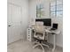 Bright office space featuring an adjustable desk, modern chair, and ample natural light at 8990 Azalea Sands Ln # 8990, Davenport, FL 33896