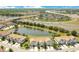 Aerial view of community featuring scenic pond and convenient highway access at 9069 Shepton St, Orlando, FL 32825