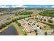 Aerial view showcasing the community's proximity to highway access and a serene pond at 9069 Shepton St, Orlando, FL 32825