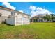 Large, well-manicured backyard with a white picket fence at 9069 Shepton St, Orlando, FL 32825