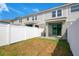 Fenced backyard features a sliding glass door leading to the home's interior at 9069 Shepton St, Orlando, FL 32825