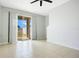 A bright living room with tile flooring and sliding glass doors leading to the outdoors at 9069 Shepton St, Orlando, FL 32825