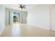 A bright living room with tile flooring and sliding glass doors leading to the outdoors at 9069 Shepton St, Orlando, FL 32825