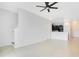 Bright living room with neutral tile floors and stairs leading to the upper level at 9069 Shepton St, Orlando, FL 32825
