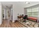 This is a view of a bedroom used as office space with hardwood floors and natural light at 976 Eagle Bay St, Winter Springs, FL 32708