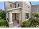 Charming front porch with white columns and space for seating, complemented by lush landscaping at 976 Eagle Bay St, Winter Springs, FL 32708