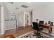 This hallway has wood floors that leads to an office area, and a laundry room at 976 Eagle Bay St, Winter Springs, FL 32708