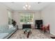 Well-lit living room featuring a comfortable sofa, decorative rug, and a cozy ambiance for relaxation at 976 Eagle Bay St, Winter Springs, FL 32708