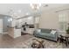 Open concept living area featuring stylish furniture and a modern kitchen island, perfect for entertaining at 976 Eagle Bay St, Winter Springs, FL 32708