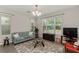 Bright living room with a plush sofa, stylish rug, and ample natural light streaming through the windows at 976 Eagle Bay St, Winter Springs, FL 32708