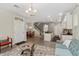 Open floor plan featuring a cozy living room, dining area, kitchen with breakfast bar, and staircase at 976 Eagle Bay St, Winter Springs, FL 32708