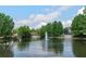 Community pond with trees and a fountain. Plenty of greenery surrounding the water feature at 976 Eagle Bay St, Winter Springs, FL 32708
