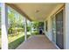 Covered patio overlooking backyard space; great for outdoor relaxing and entertaining at 9836 Old Patina Way, Orlando, FL 32832