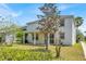 Spacious backyard featuring a covered patio and lush greenery, perfect for outdoor entertaining and relaxation at 9836 Old Patina Way, Orlando, FL 32832
