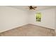 Neutral bedroom featuring a window and carpet flooring, perfect for relaxation and comfort at 9836 Old Patina Way, Orlando, FL 32832