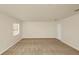 Neutral carpeted bedroom with good natural light and a closet at 9836 Old Patina Way, Orlando, FL 32832