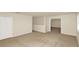 Upstairs bonus room with neutral carpet and access to the other areas of the home at 9836 Old Patina Way, Orlando, FL 32832