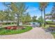 Community park featuring a brick pathway, landscaping and park benches for outdoor enjoyment at 9836 Old Patina Way, Orlando, FL 32832