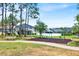 Community playground featuring swings and a seating area for Gathering fun and relaxation at 9836 Old Patina Way, Orlando, FL 32832