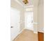 Welcoming foyer featuring tiled floors and a decorative front door with a glass panel at 9836 Old Patina Way, Orlando, FL 32832