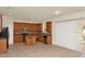 Well-lit kitchen featuring tile floors, wood cabinets, and stainless steel appliances at 9836 Old Patina Way, Orlando, FL 32832