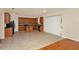 Open kitchen featuring stainless steel appliances, island, and access to the living room at 9836 Old Patina Way, Orlando, FL 32832