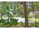 Scenic lake view showcasing lush greenery and a peaceful waterfront setting for relaxation at 9836 Old Patina Way, Orlando, FL 32832