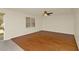 Bright living room featuring hardwood floors, a ceiling fan and natural light at 9836 Old Patina Way, Orlando, FL 32832