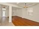 Bright living room featuring hardwood floors and recessed ceiling detail near the entryway at 9836 Old Patina Way, Orlando, FL 32832
