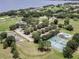 Wide aerial view showcasing the community's proximity to the lake and recreational facilities at 10249 Spring Lake Dr, Clermont, FL 34711