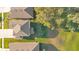 Aerial shot displays rooftops blending with verdant lawns and shaded by mature trees, offering a tranquil ambiance at 10249 Spring Lake Dr, Clermont, FL 34711