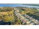The aerial photograph shows residential neighborhoods alongside lake, combining suburban charm with waterside serenity at 10249 Spring Lake Dr, Clermont, FL 34711