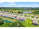 This aerial perspective showcases this community's blend of residential comfort, water features, and abundant landscaping at 10249 Spring Lake Dr, Clermont, FL 34711