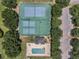 Aerial view of the community's recreational area featuring tennis courts, basketball court and swimming pool at 10249 Spring Lake Dr, Clermont, FL 34711