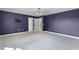Spacious bedroom with a modern chandelier, plush carpet, and doors leading to other rooms at 10249 Spring Lake Dr, Clermont, FL 34711