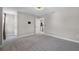 Neutral bedroom with plush carpeting and plenty of space for storage, and attached bathroom at 10249 Spring Lake Dr, Clermont, FL 34711