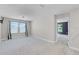 Spacious bonus room with plush carpeting, light-filled windows, and fresh neutral paint at 10249 Spring Lake Dr, Clermont, FL 34711