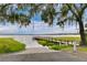 Community pier with wooden boardwalk, perfect for serene waterfront views and enjoying nature's beauty at 10249 Spring Lake Dr, Clermont, FL 34711