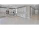 Bright, modern kitchen featuring white cabinets, a center island and stainless steel appliances at 10249 Spring Lake Dr, Clermont, FL 34711